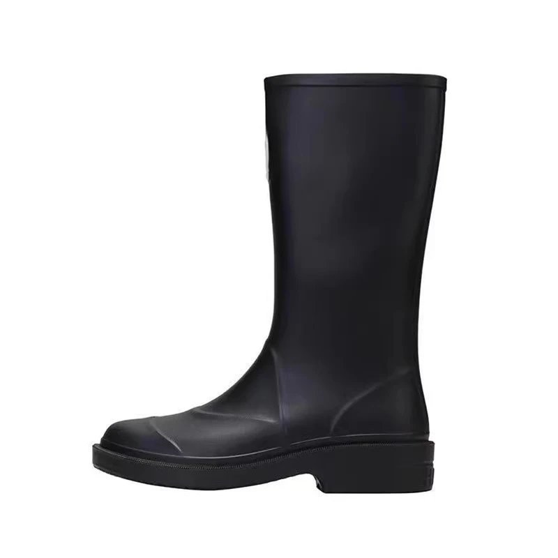 Chanel's iconic CC logo rubber rain boots. qc 3