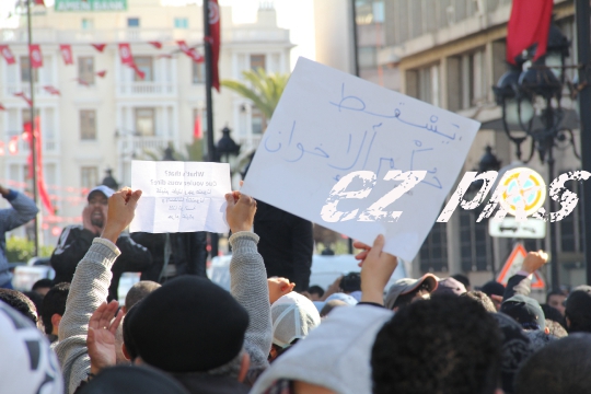 Demonstrators protesting the killing of Tunisian opponent 