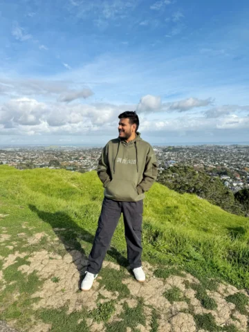Standing at the summit of Mount Eden, one of Auckland’s highest volcanic cones �