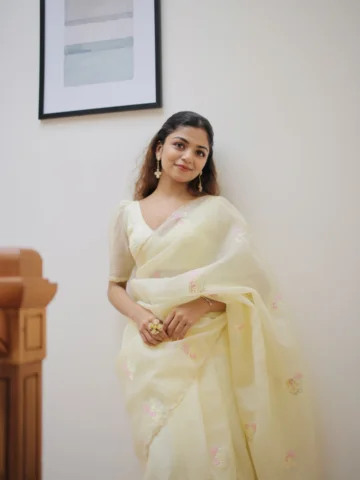 Butter Bloom, an adorable butter yellow crushed silk saree that has pink, light 