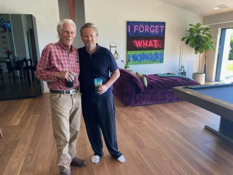 Here is me, and my father John, both holding a beverage.