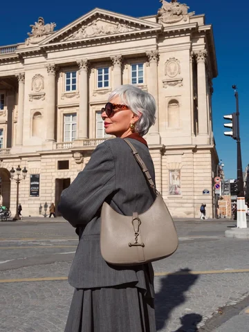 On the go between meetings and errands in Paris, my @strathberry Kite Sling adds