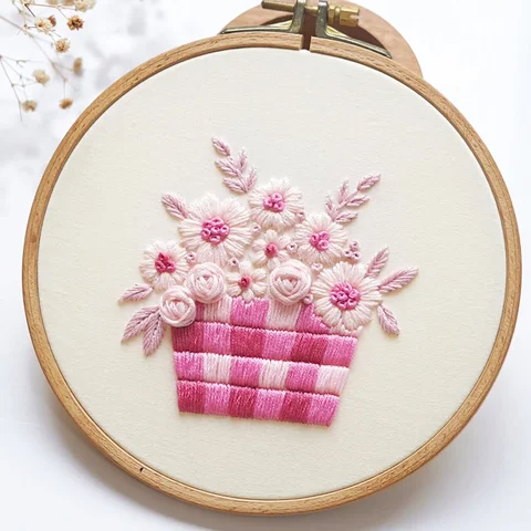 My new design is ready ✨
A pink gingham basket embroidery filled with spring flo