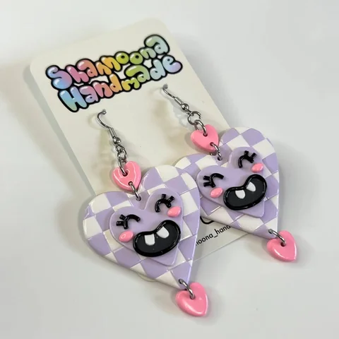 Earrings of the day - smiling heart earrings 💜 love the goofy smile on them