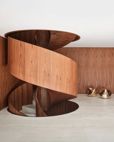 Exploring verticality within a constrained urban plot, this residence organizes 