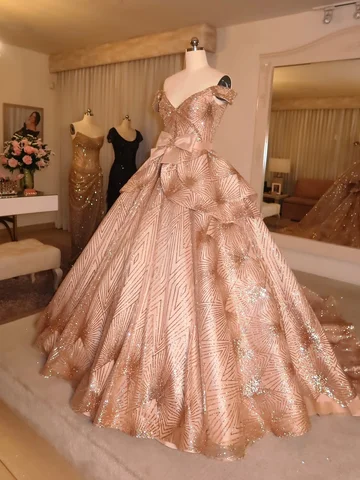 A vision of light, sculpted in blush and adorned with radiance.

The voluminous 