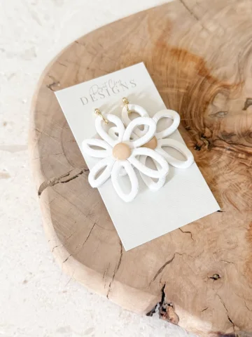 The Groovy Daisy Dangles | Who doesn’t love a good statement earring that will g