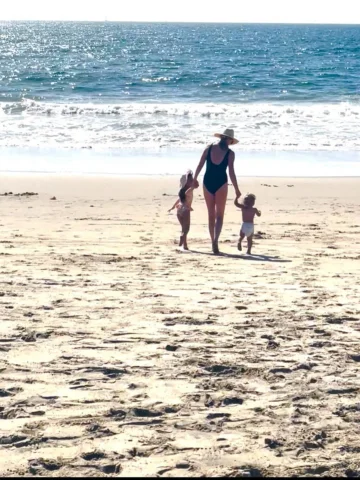 Those tiny hands and our feet in the sand… nothing better ☀️✨💛
