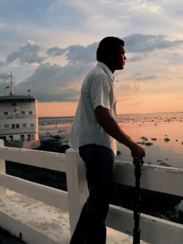 Muhammad Ali looking towards River Zaire during the sunset before his fight vs G