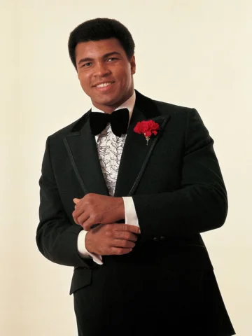 A portrait of Muhammad Ali wearing a tuxedo during photo shoot in Chicago, IL.

