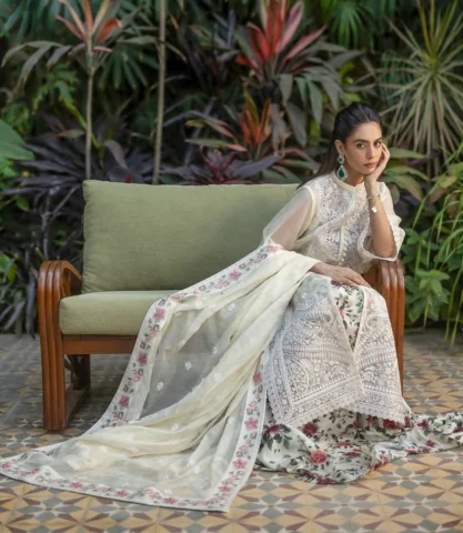 Baela

This stunning ivory ensemble features a sheer khaadi net, long-line tunic