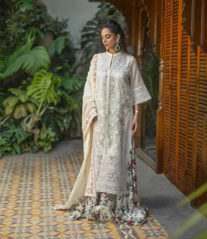 Baela

This stunning ivory ensemble features a sheer khaadi net, long-line tunic