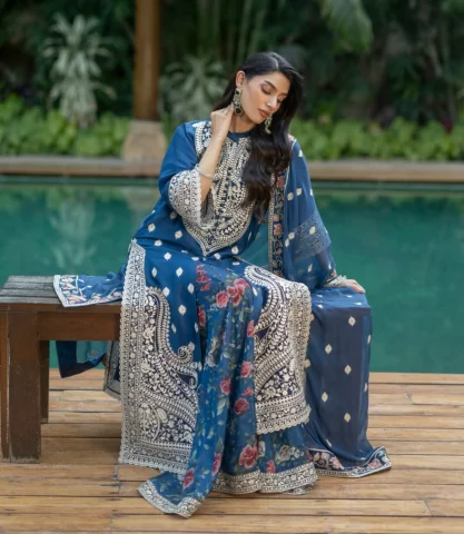 Rihya

This striking teal-indigo ensemble features a long, front-slit tunic meti