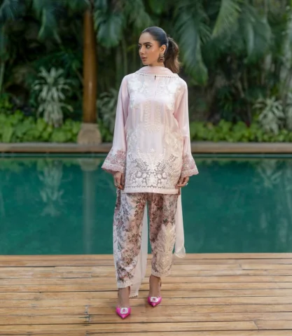 Luna 

The heart of this ensemble is a short, straight-cut tunic meticulously cr