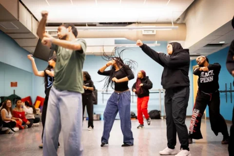 Dancing in unison, rehearsing lines, practicing instruments, harmonizing togethe