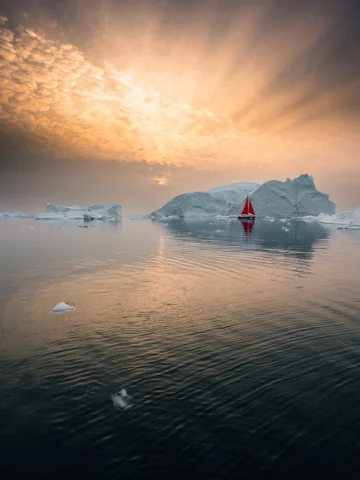 Colorful skies above,
ice drifting below,
and a quiet path through frozen water.