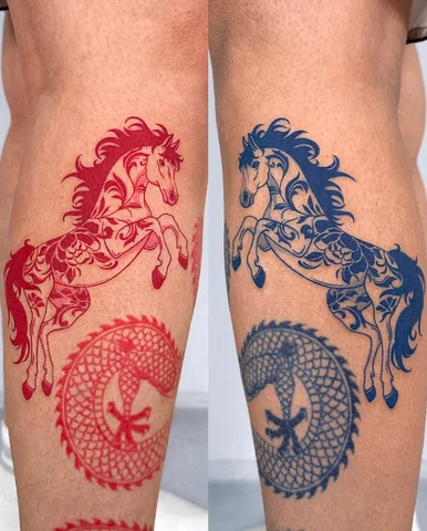 A symmetrical composition of a red horse and a blue horse placed on the calves.
