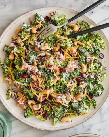 Hands down THE BEST broccoli salad! With cheese, cashews, red onion, crispy baco