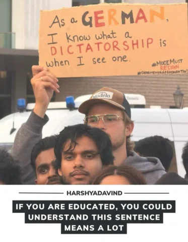 A German supporter joined the student protest, holding a poster that quickly cau
