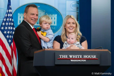 Karoline Leavitt takes a family photo with her husband, Nicholas Riccio, and the