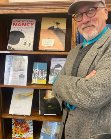 The library at Holy Cross has a fantastic graphic novel section (thanks to Mark 