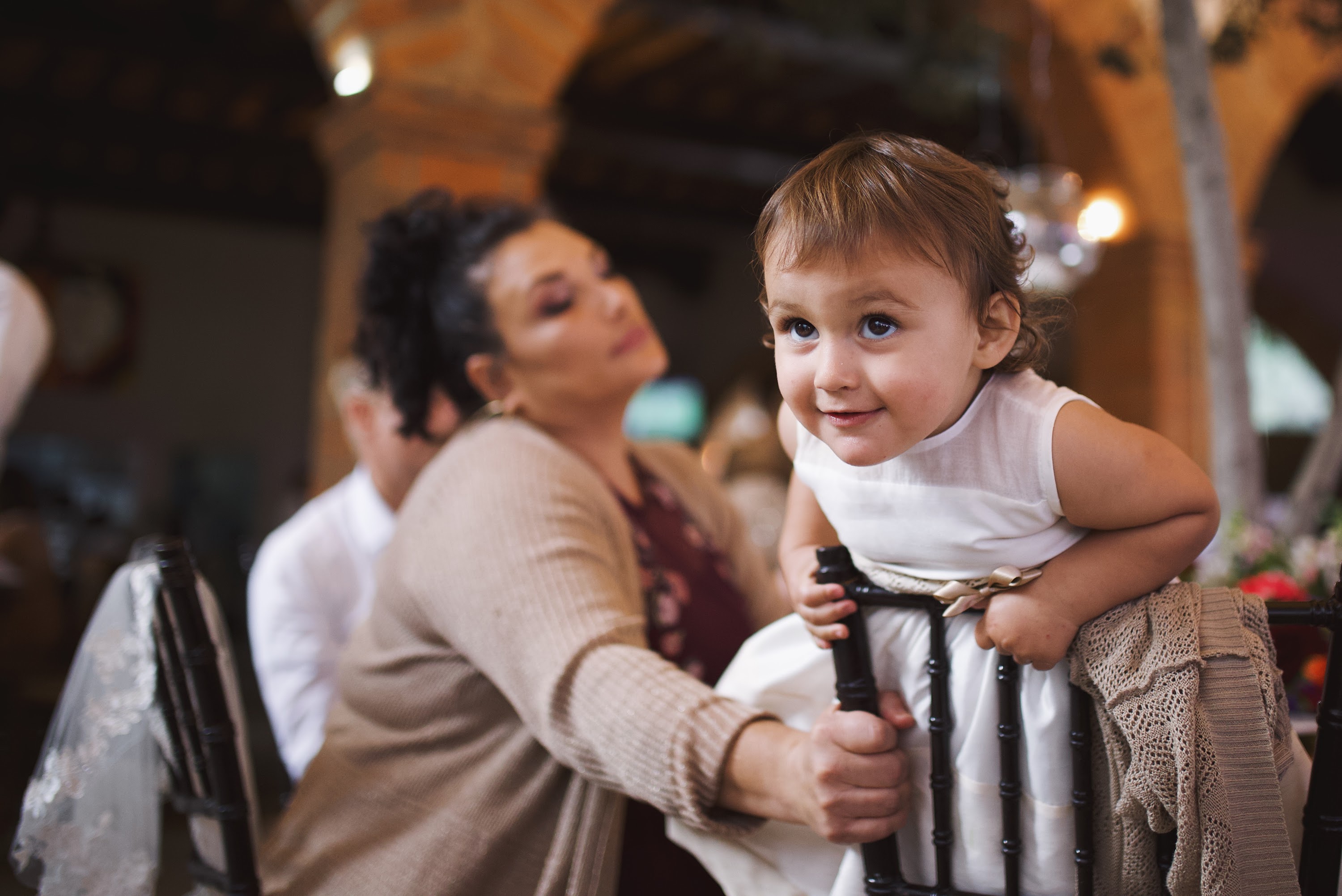 Smiling Toddler at Indoor Celebration