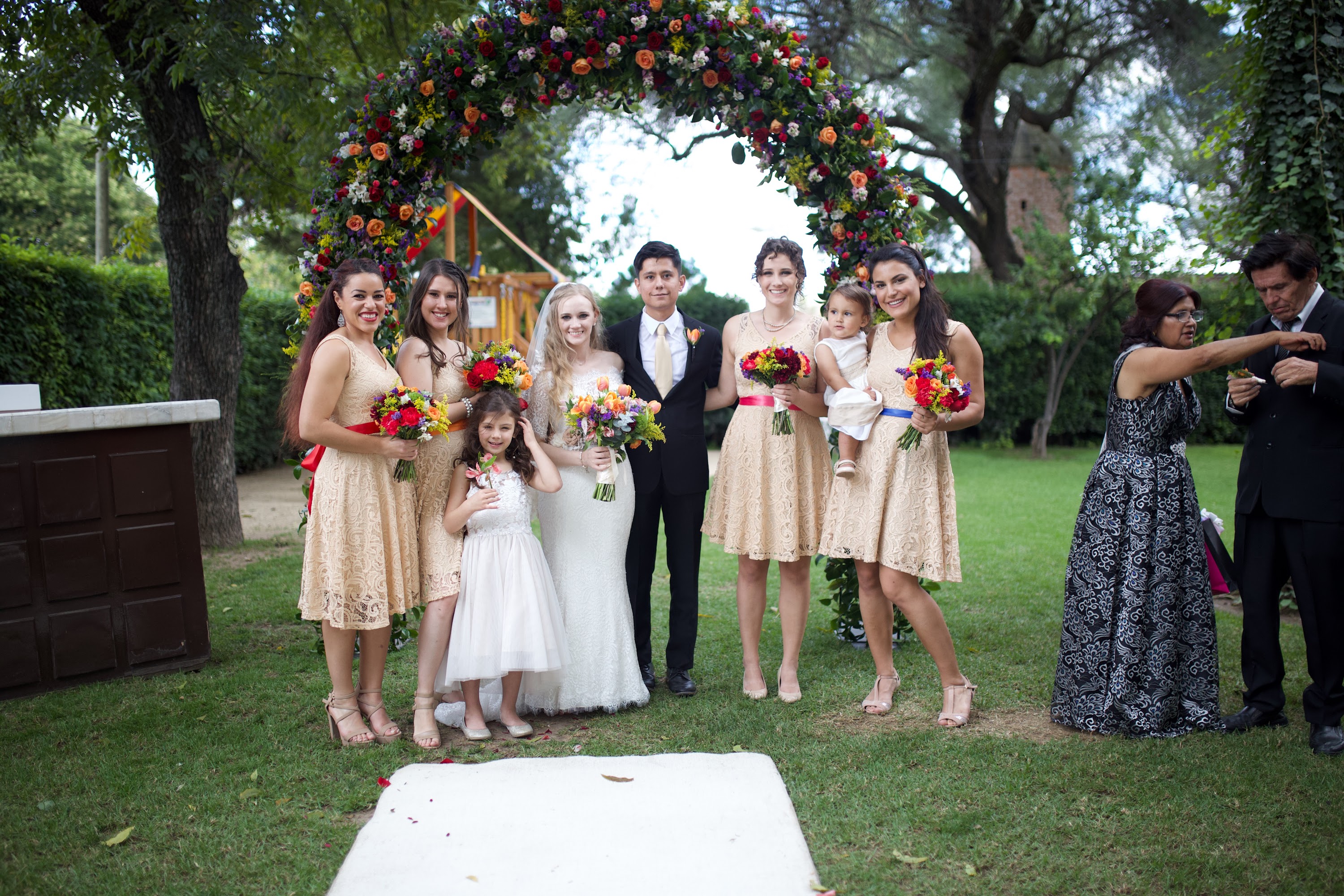 Wedding Party Under Floral Arch