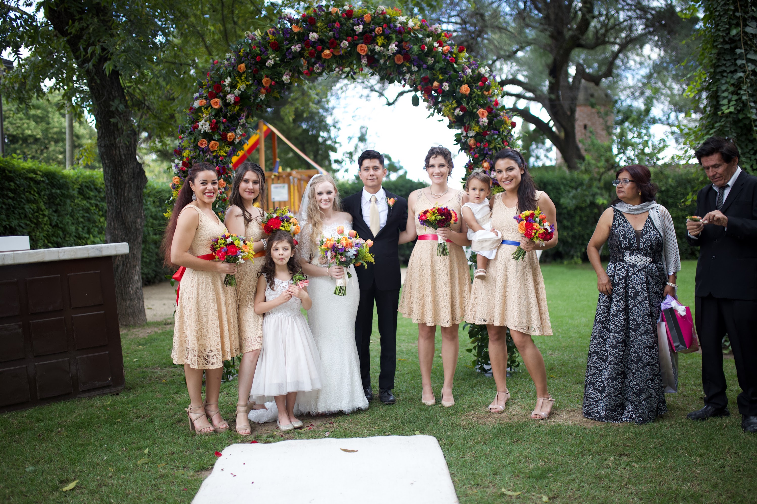 Wedding Party Under Floral Arch