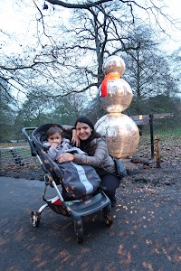 Woman and Child with Disco Snowman in Park