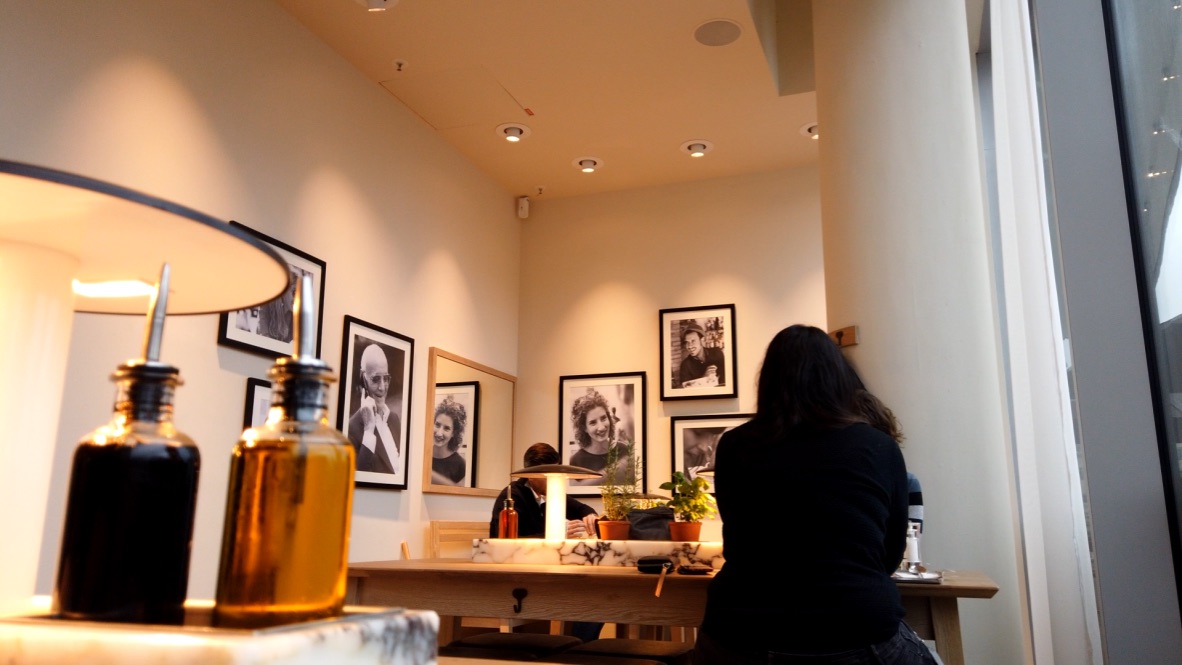 Interior of a Modern Café with Black-and-White Portraits