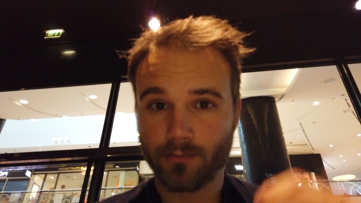 Man Taking Selfie in Shopping Mall