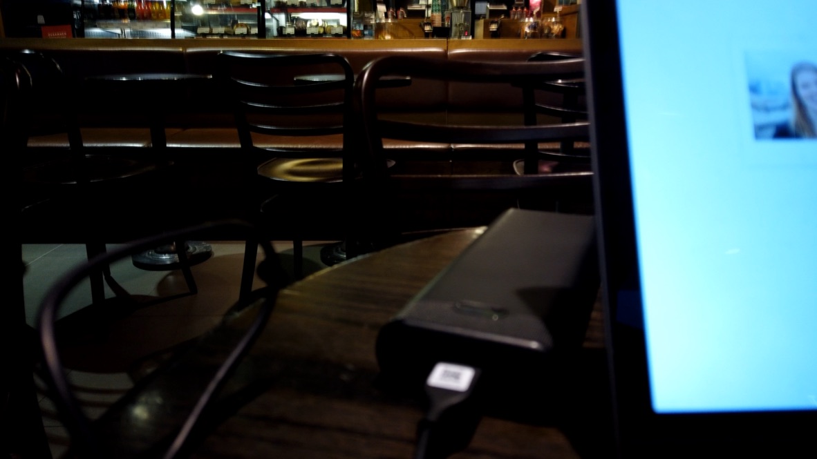 Power Bank on Table in Dimly Lit Cafe