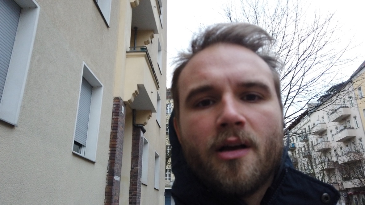 Man Taking Selfie on City Street