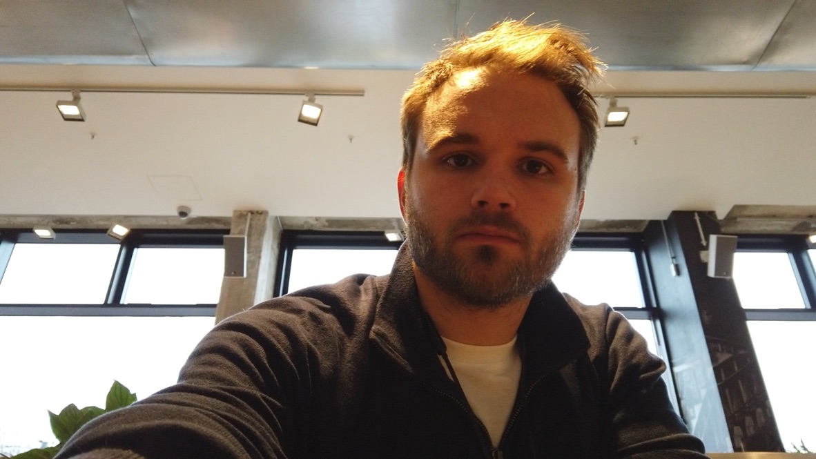 Man with Red Hair Taking Selfie Indoors