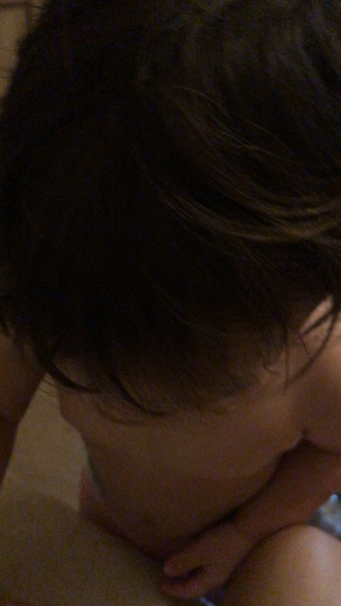 Child with Dark Hair Bending Over