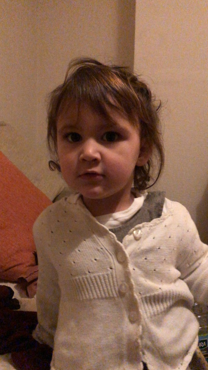 Young Girl Sitting Indoors