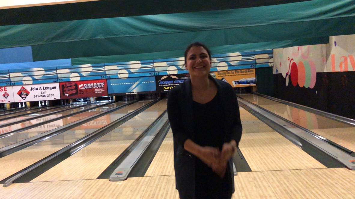 Woman Smiling in Bowling Alley
