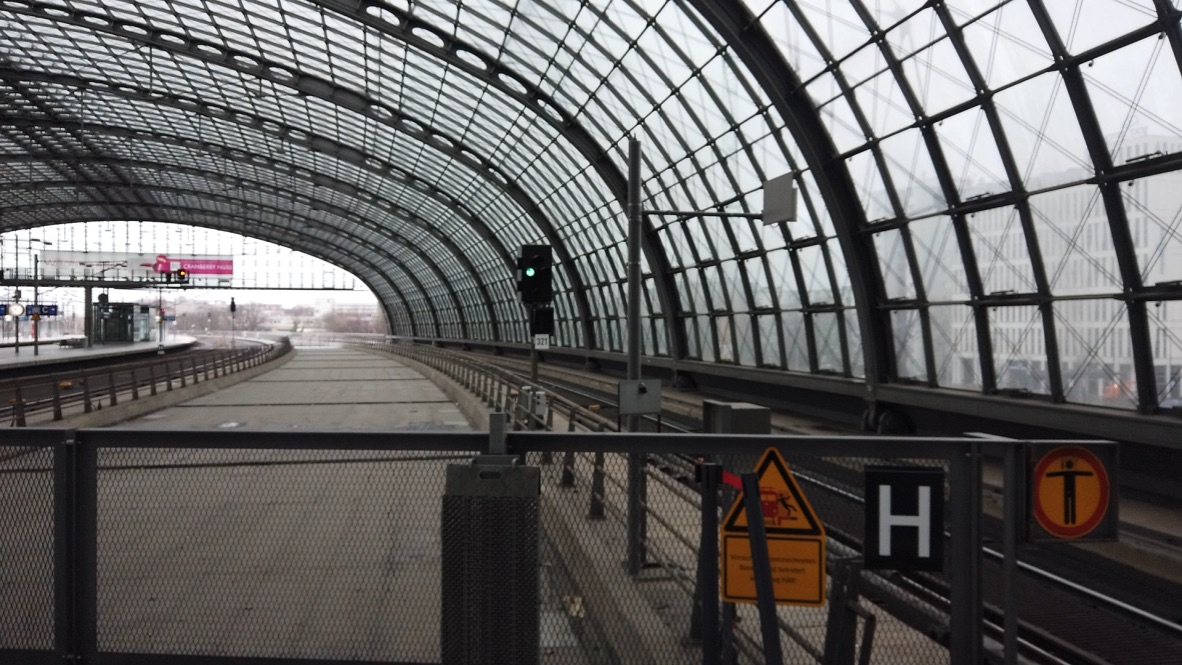 Empty Train Station Platform Under Glass Roof