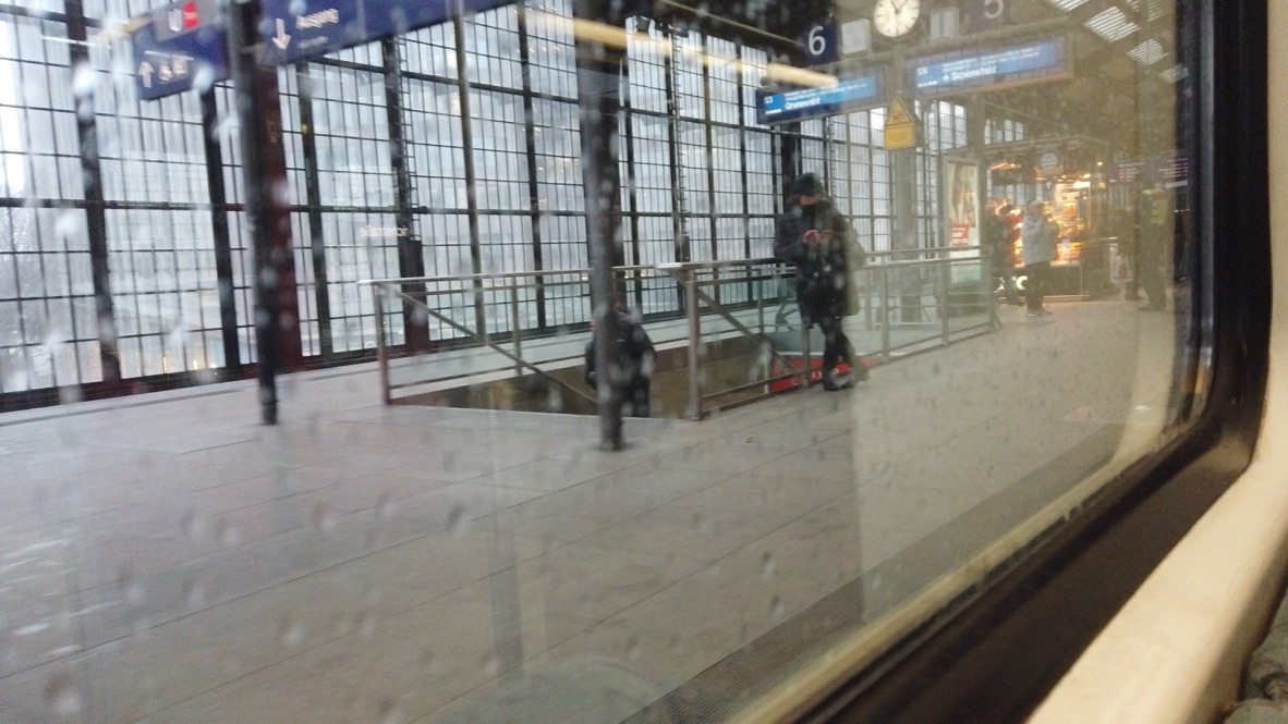 Train Station Platform View Through Rainy Window
