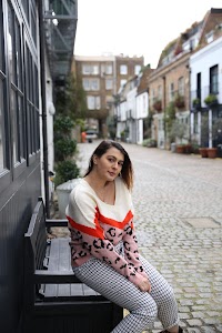Woman in Green Floral Dress Walking on London Sidewalk