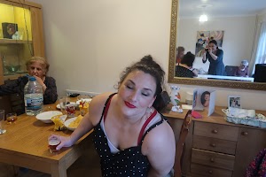 Woman in Polka Dot Dress at Family Gathering