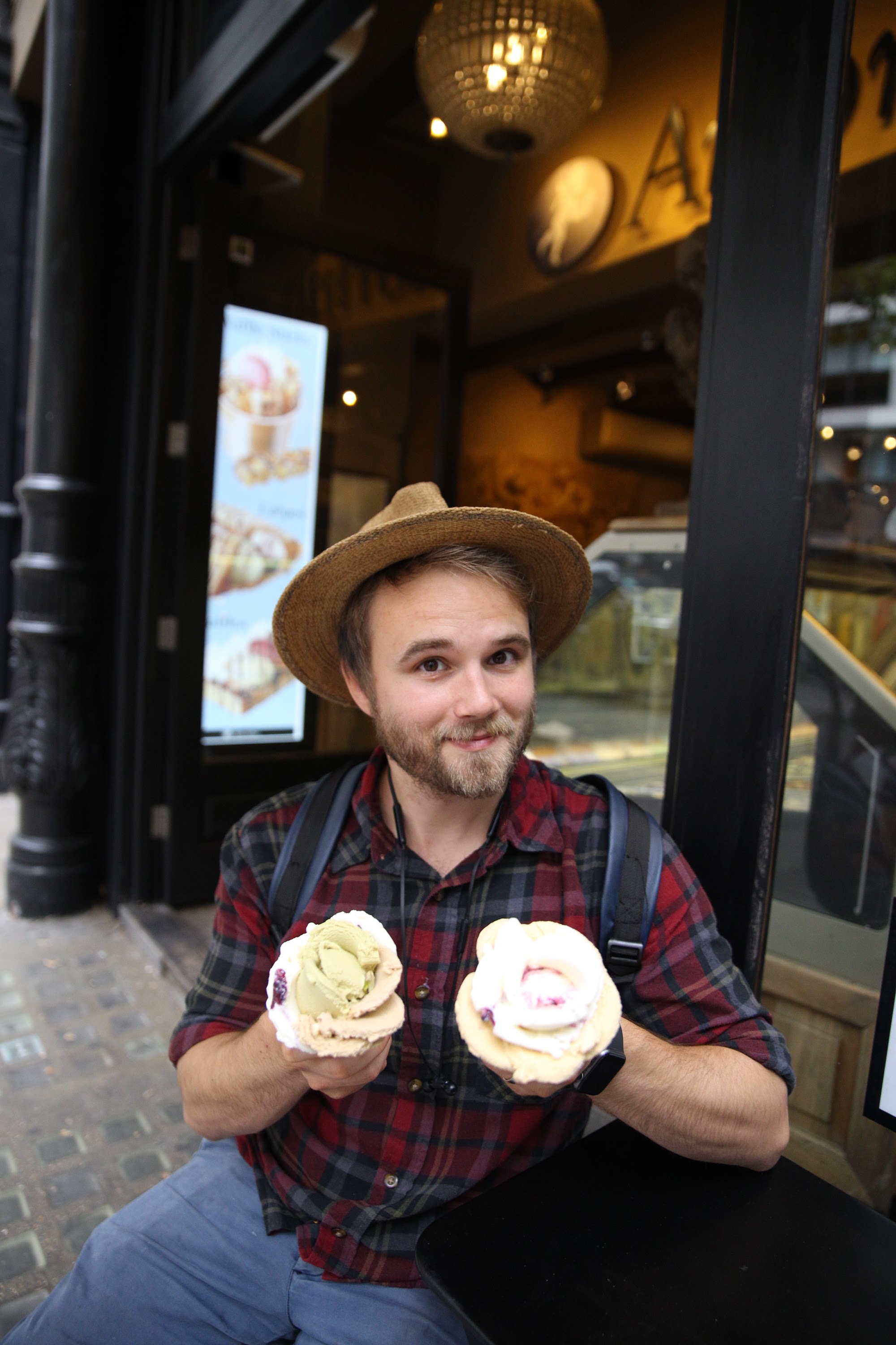 Man Enjoying Ice Cream Outside a Shop
