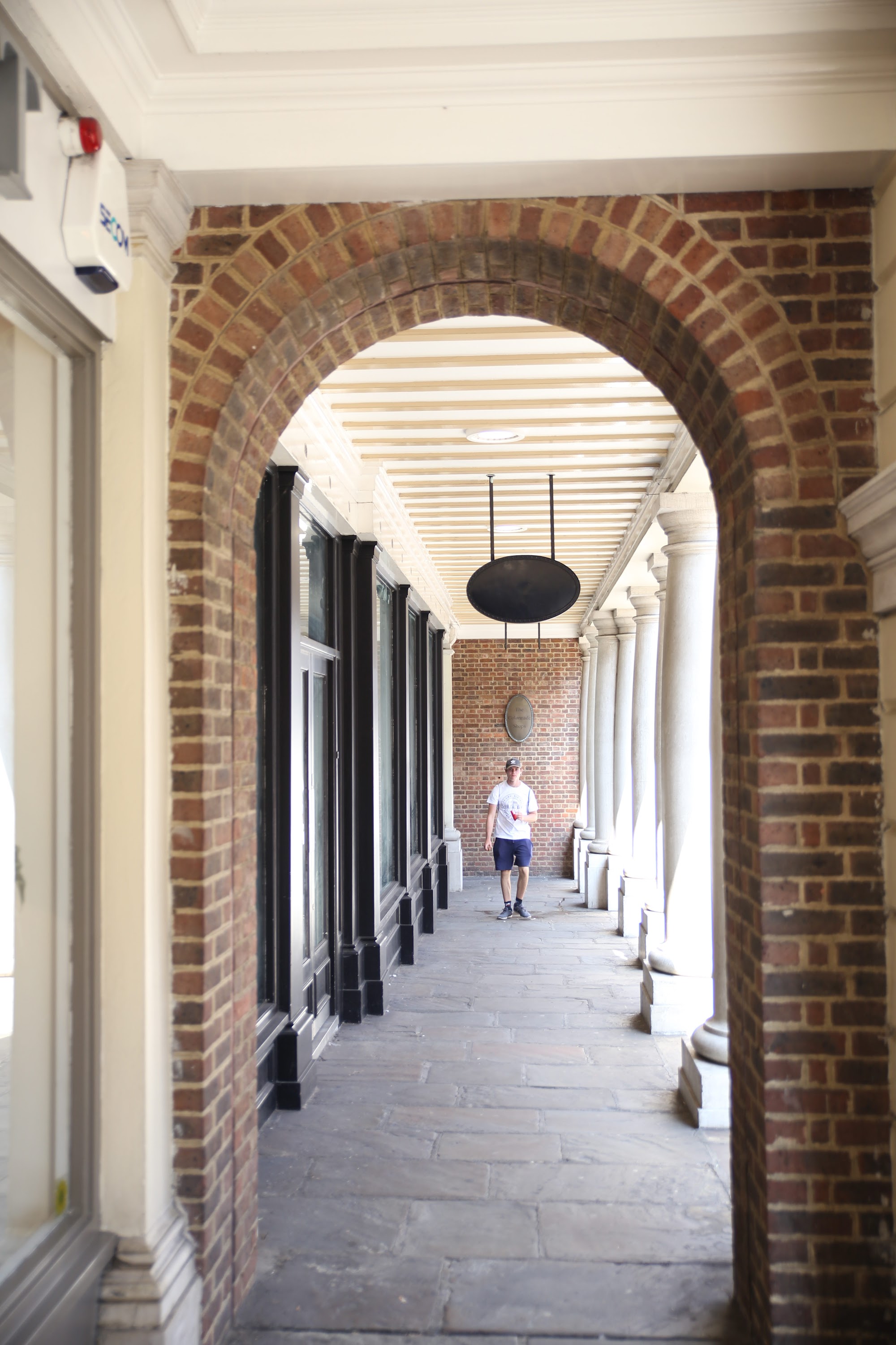 Woman in Red Dress on Historic London Shopping Lane