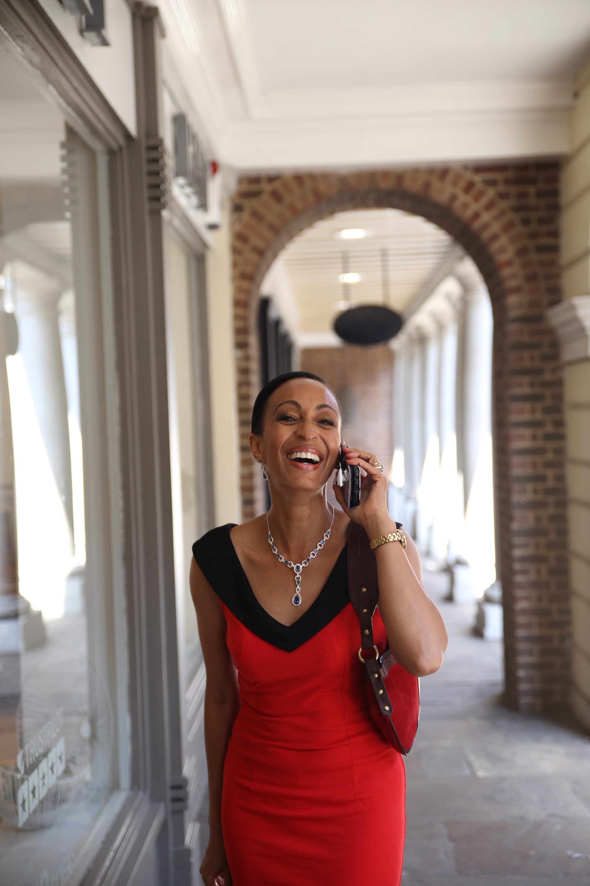 Woman in Red Dress on Historic London Shopping Lane