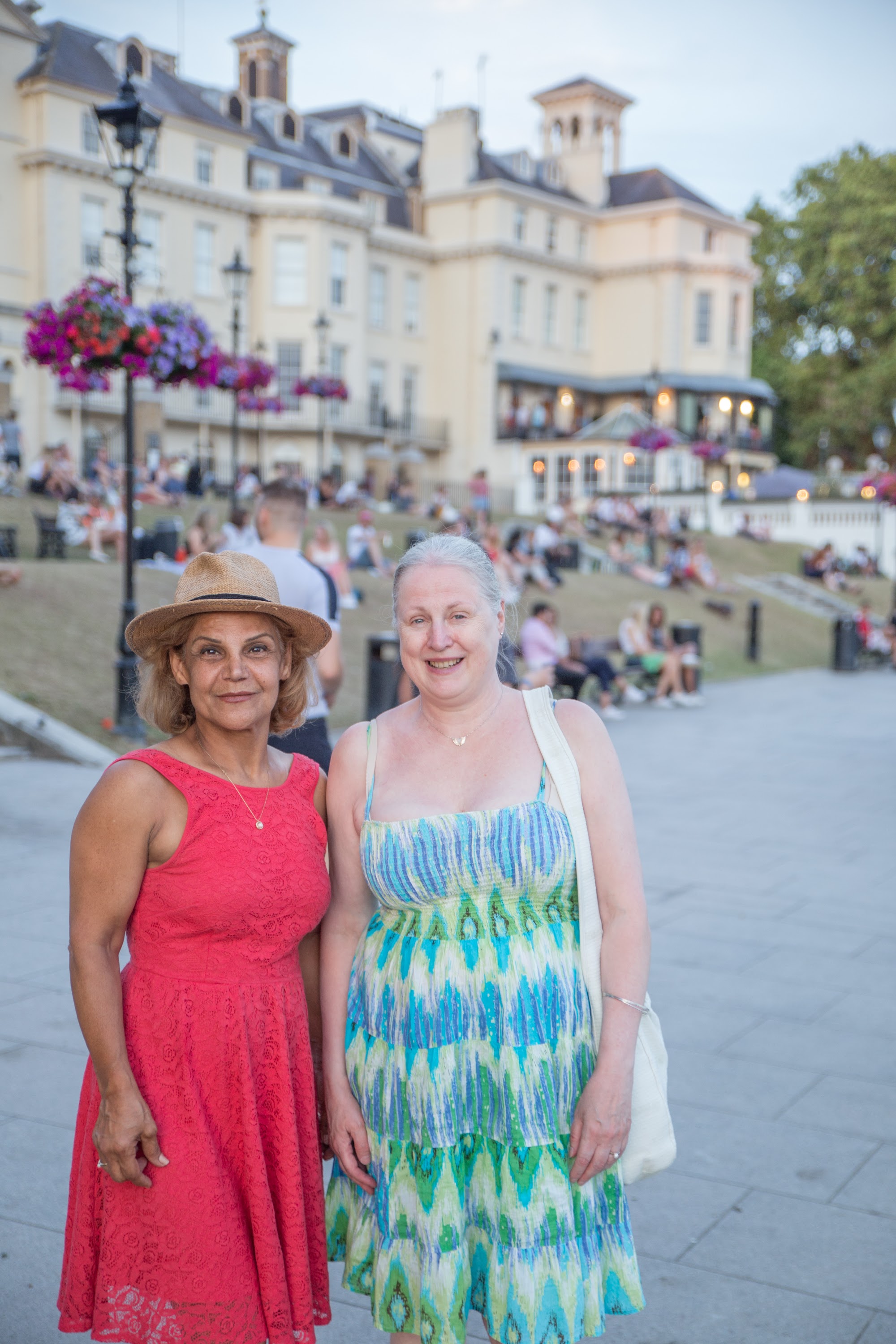 Two Women Posed for Photo in Front of Historic Building