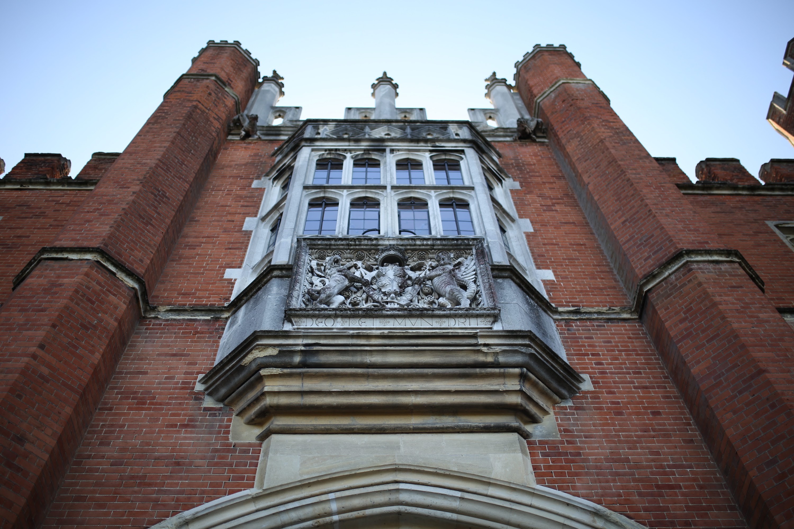 Historic Brick Building with Stone Coat of Arms and Bay Window