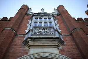 Historic Brick Building with Stone Coat of Arms and Bay Window