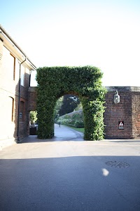 Vine-covered Archway at Historic Estate Entrance