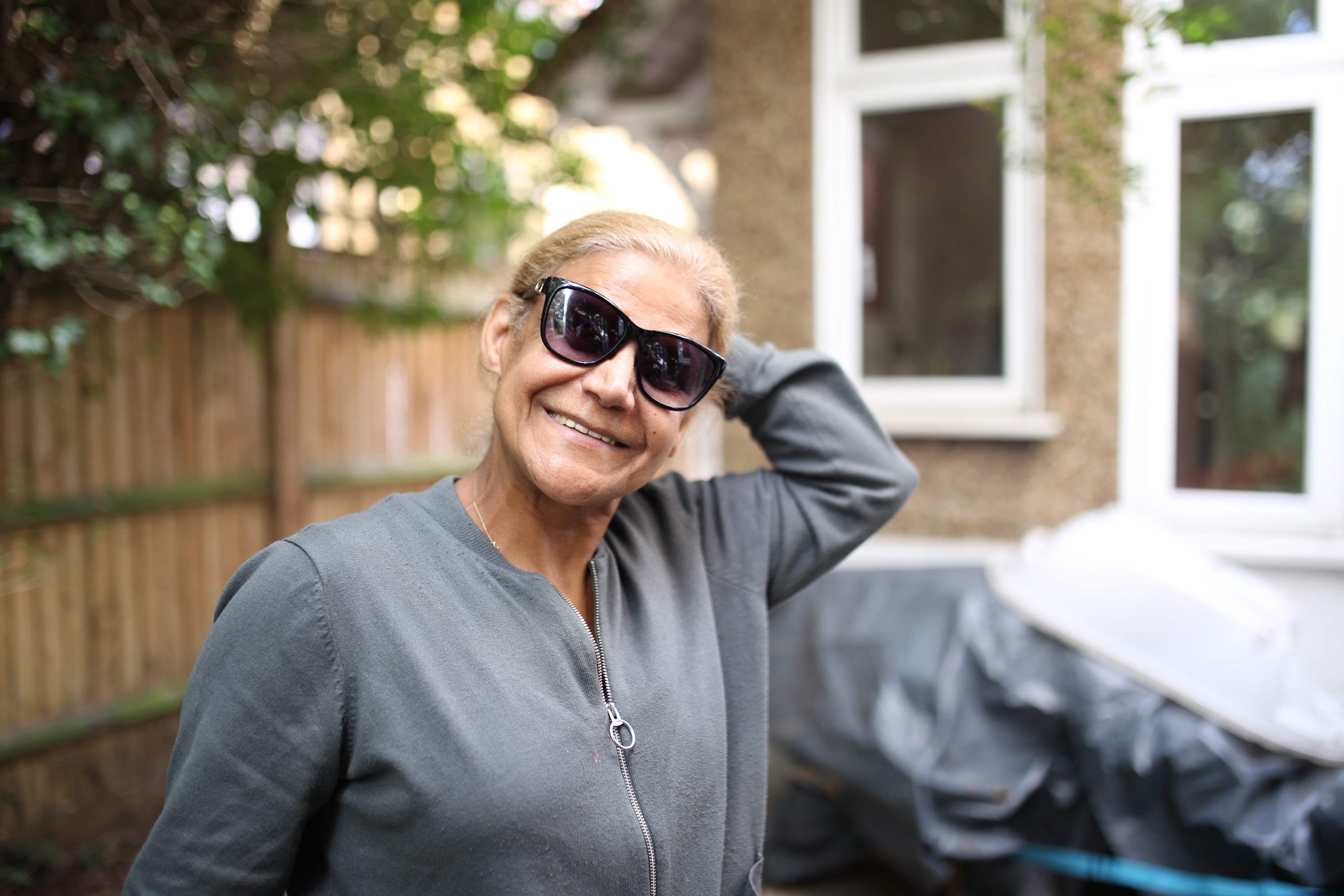 Smiling Woman in Sunglasses Outdoors