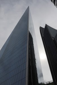 Modern Skyscraper Against Overcast Sky